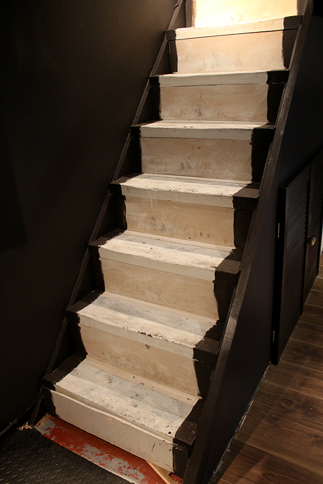 cellar stairway painted dark without stair runner - progress