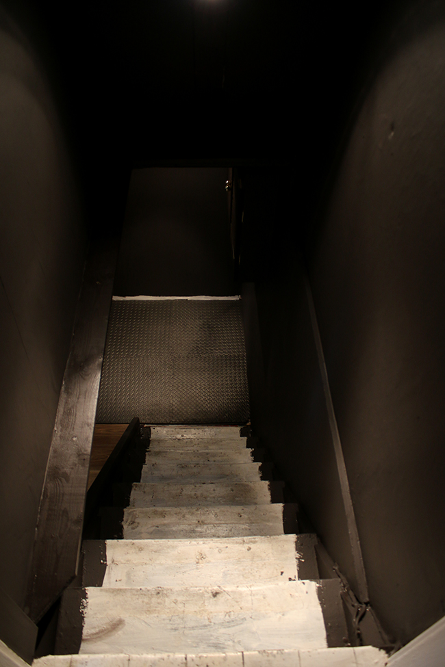 cellar stairway painted dark without stair runner - progress