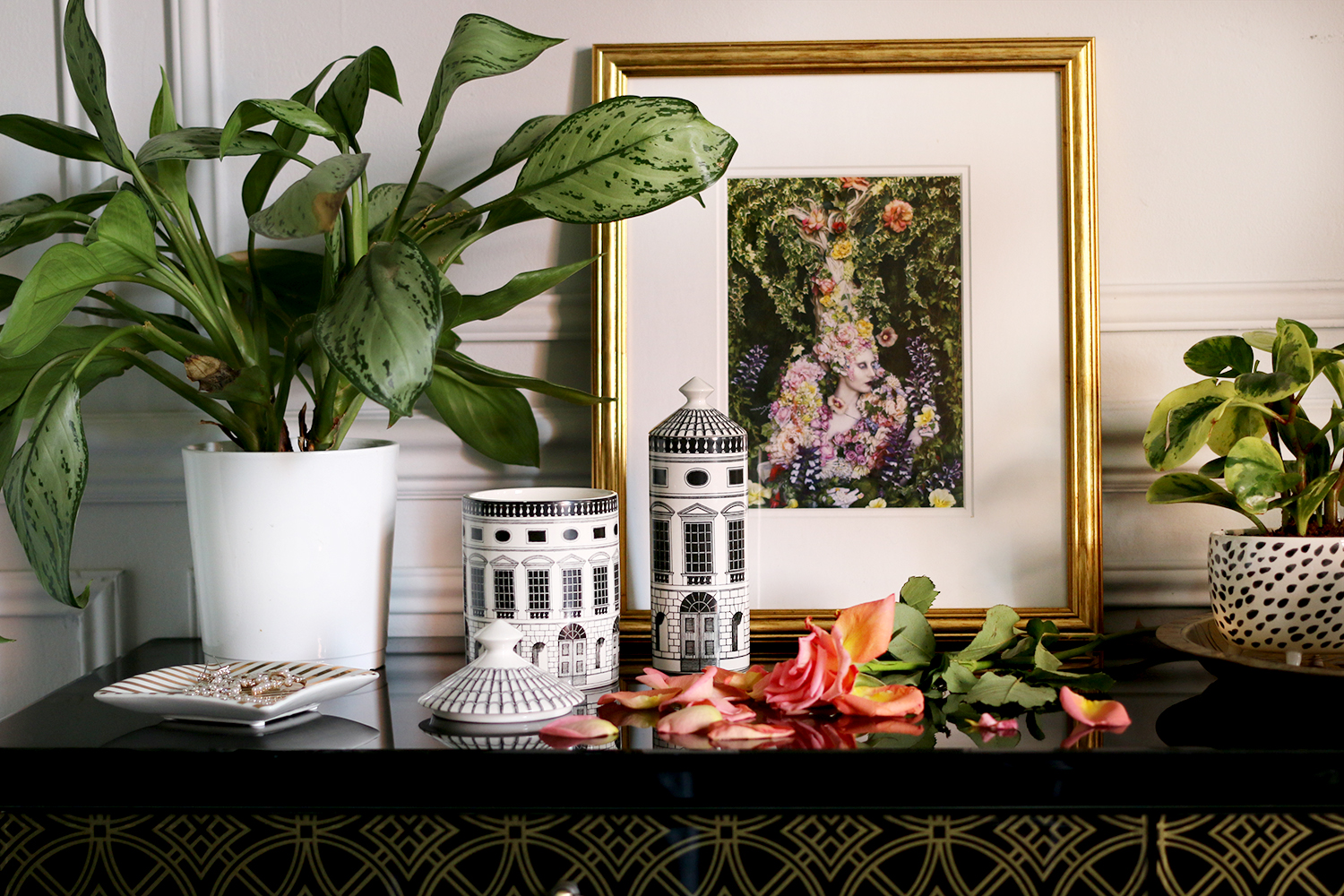 Fornasetti Architettura Scented Candle and room spray on black and gold console with plant