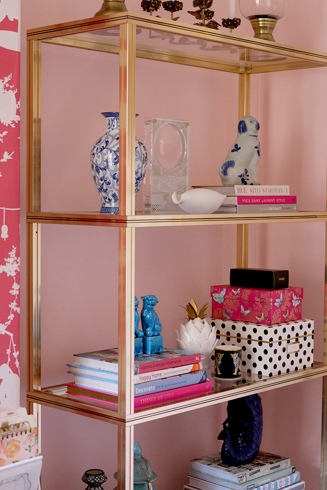 boho glam office with black desk and gold brass glass shelving units