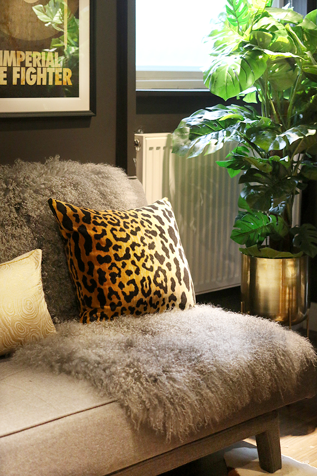 grey sofa with mongolian throw and leopard print cushion