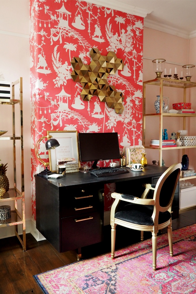 boho glam office with black desk and gold brass glass shelving units