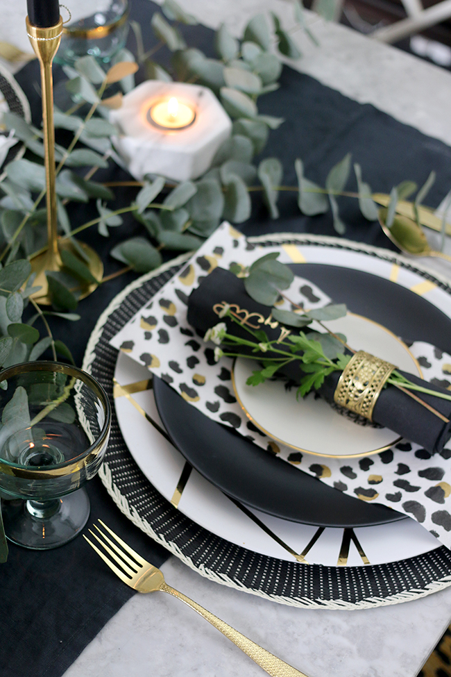 Adding the finishing touches to my Autumn tablescape in black white gold and green