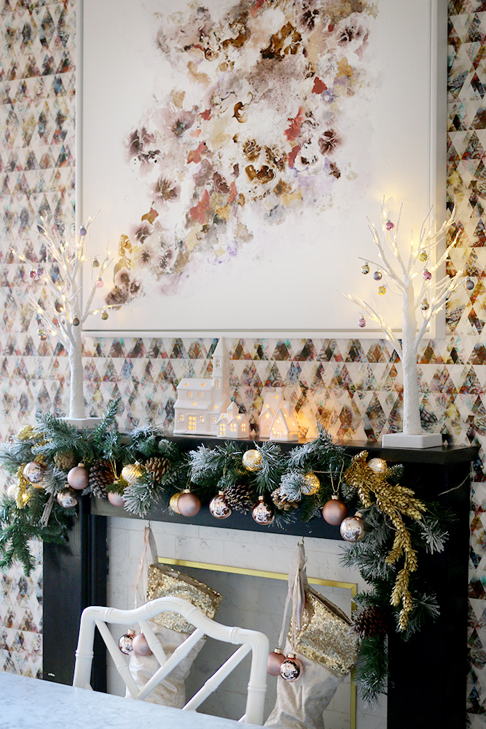 Christmas dining room with original art on mantle