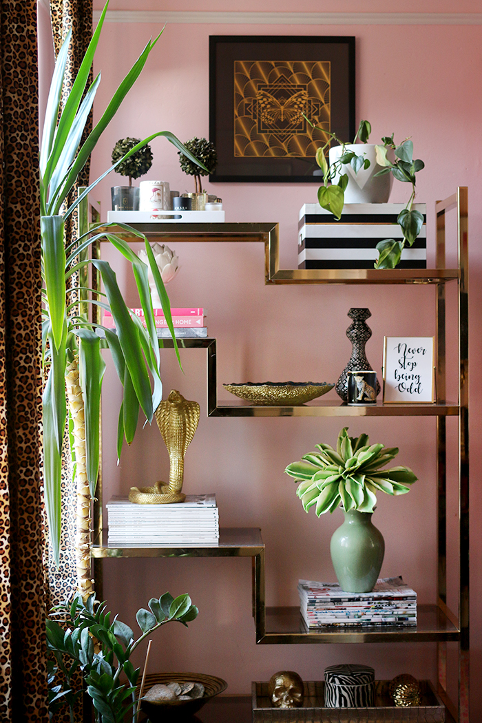 These are the 8 things every home office needs including a brass and glass vintage shelving unit