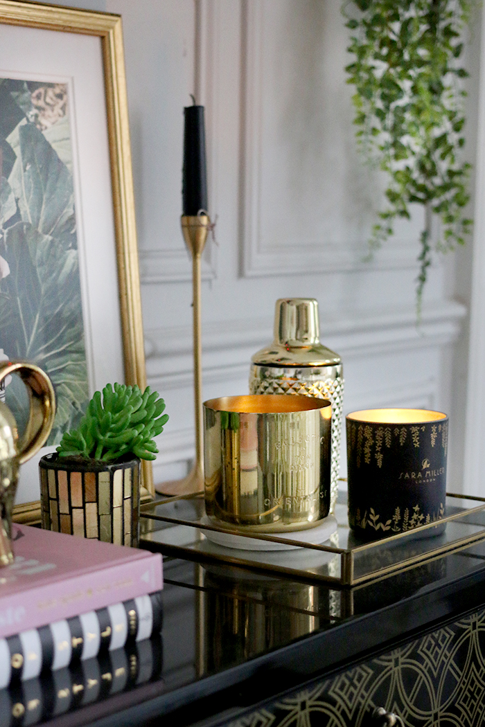 Tom Dixon Orientalist Candle and Sarah Miller London Candle vignette on black gloss with gold accessories