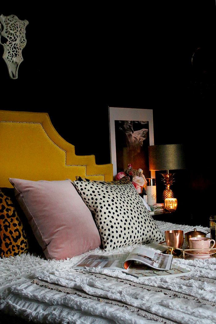 boho glam bedroom in black yellow and blush pink