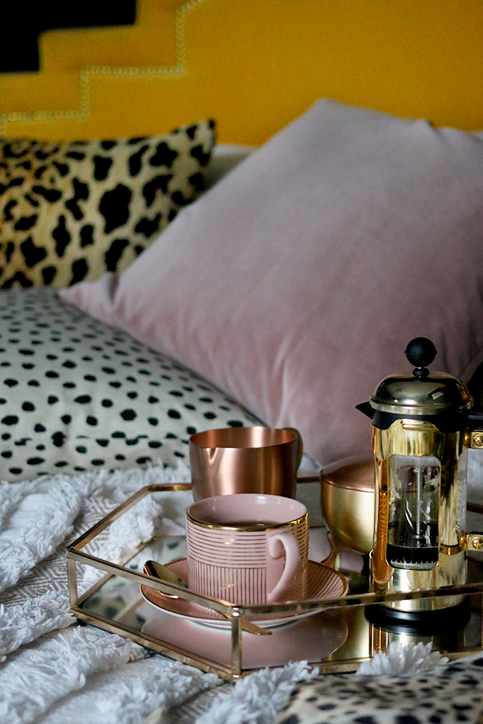 boho glam bedroom in black yellow and blush pink