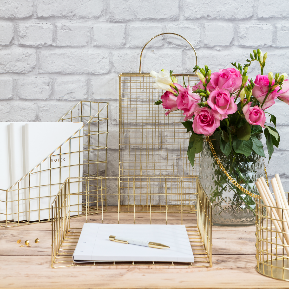 Do you have any work space essentials? Check out the 8 things every home office needs including pretty gold wire desk accessories