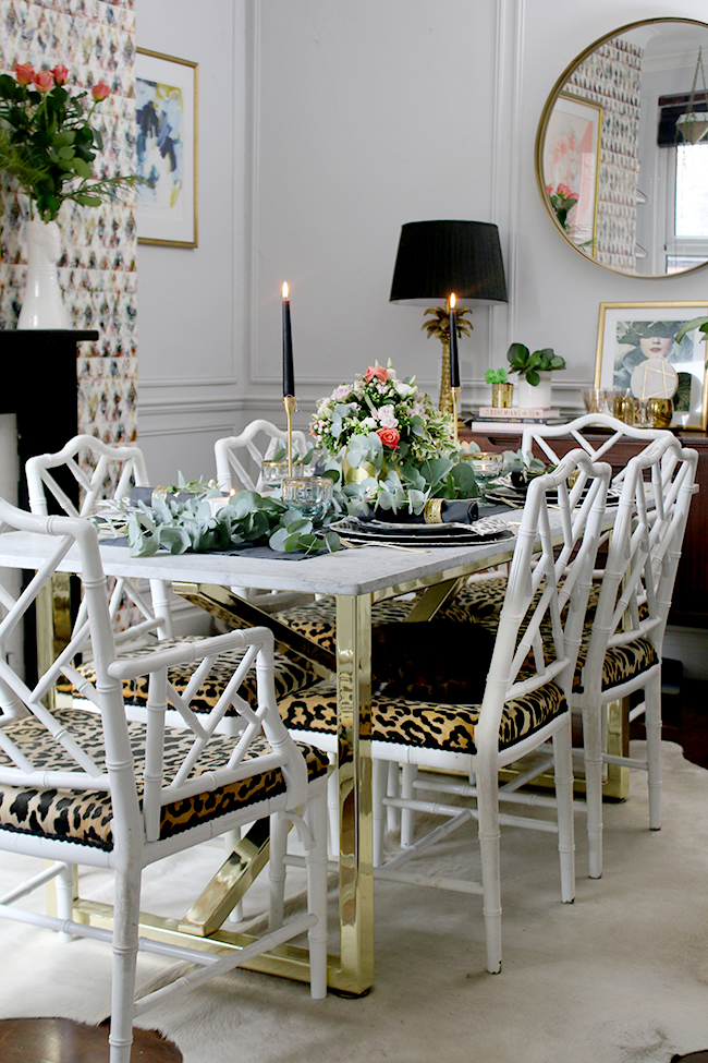 dining room table with brass base and marble top