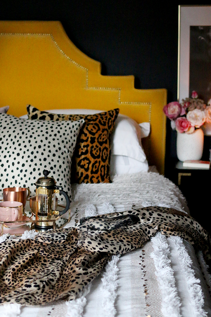 boho glam bedroom with leopard print accessories