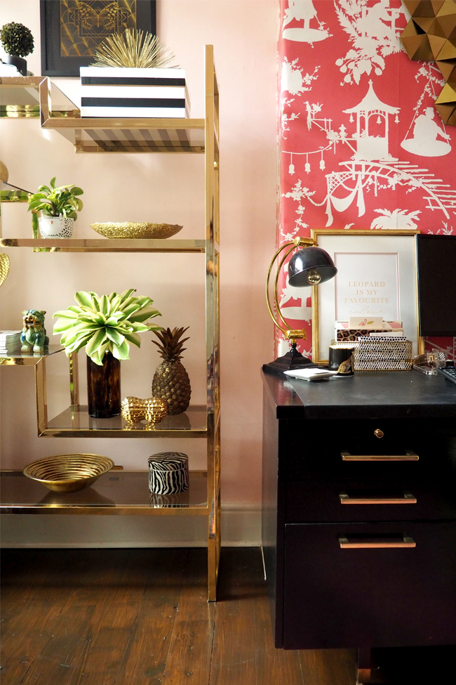 pink office with vintage glass shelving unit