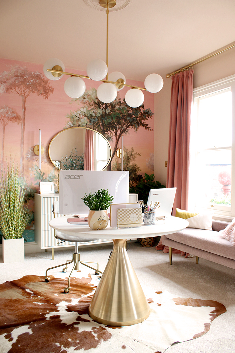 pink and peach office with round desk in middle of room